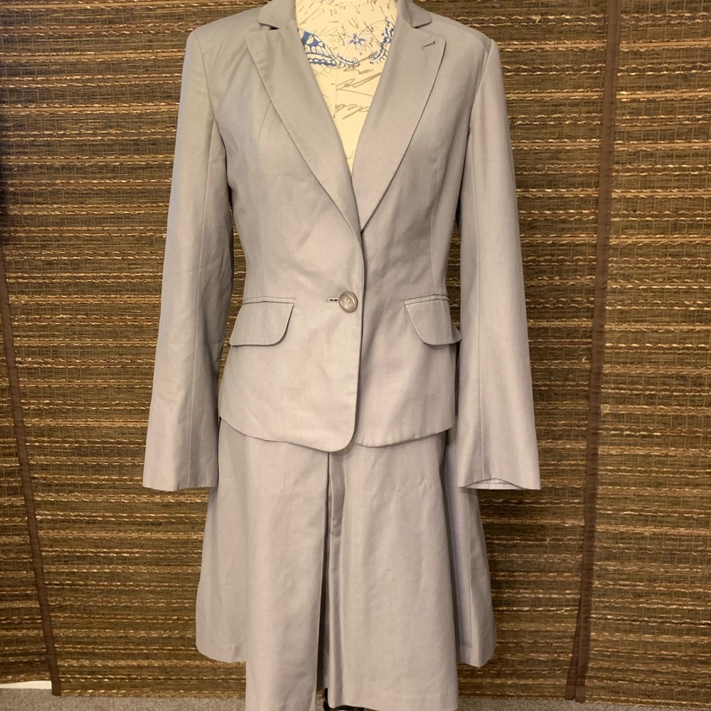 Gray women’s skirt suit (blazer and skirt)